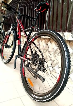 VELO super vtt americain bulls racer 29"  super vtt americain bulls racer 29"
* état : venant comme neuf 
* couleur : rouge noir
* cadre : aluminium 100% 
* pneus : 29" super large raillé à crampons pour une adhérence sur  tout terrain 
* jantes: aluminium 29" styx avec générateur électrique.
* suspension : amortisseurs hydrauliques à huile minérale réglable 
* groupe pédalier:  shimano 
* manettes: shimano 
* freins: mécanique  + disque en alliage shimano 
* transmission: shimano tourney (7×3)
* selle: bulls d